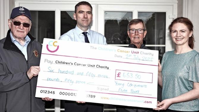 Young Conquerors Flute Band hand over charity cheques